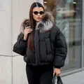 Пуховой бомбер с мехом лисы 
