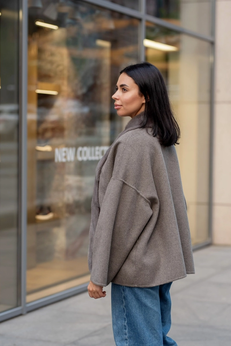 A laconic cashmere coat in grey-beige colour 