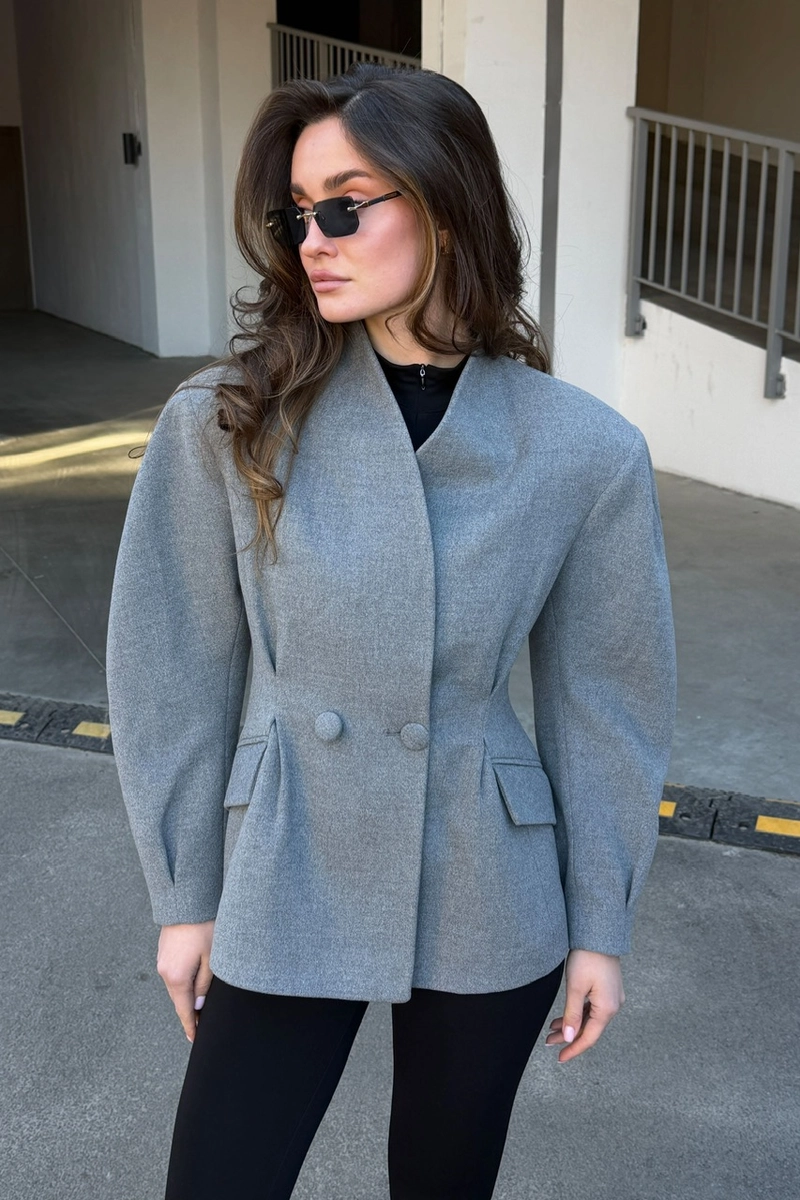 A cashmere jacket in a classic gray color.