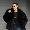 Чорна шуба із еко-хутра з ефектом лами