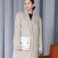 A full-length coat in a melange color