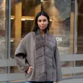 A laconic cashmere coat in grey-beige colour 