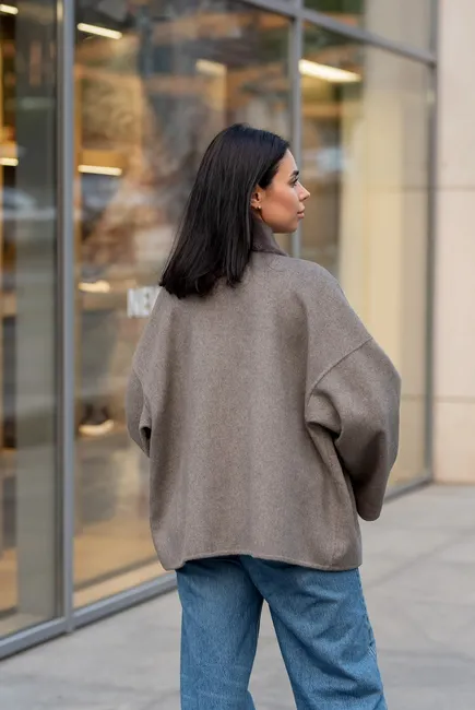 A laconic cashmere coat in grey-beige colour 