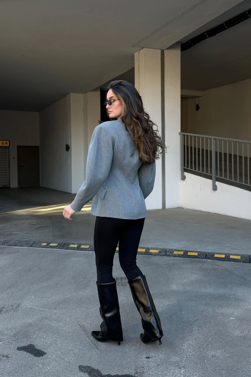 A cashmere jacket in a classic gray color.