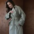 Double-breasted oversize trench coat in pistachio color