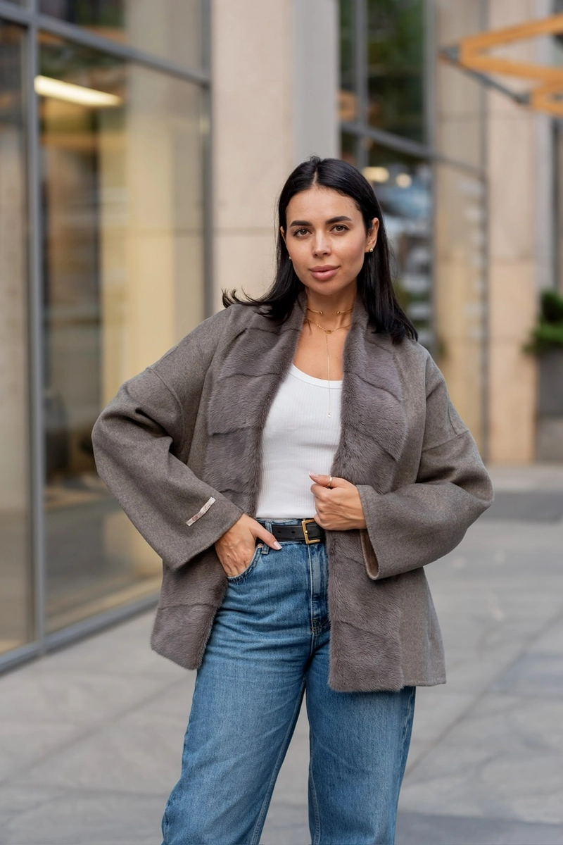 A laconic cashmere coat in grey-beige colour 